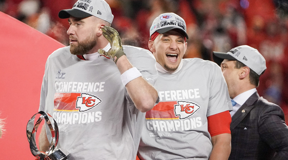 Chiefs quarterback Patrick Mahomes (15) and tight end Travis Kelce (87) celebrate after winning the AFC Championship game against the Bengals at GEHA Field at Arrowhead Stadium.