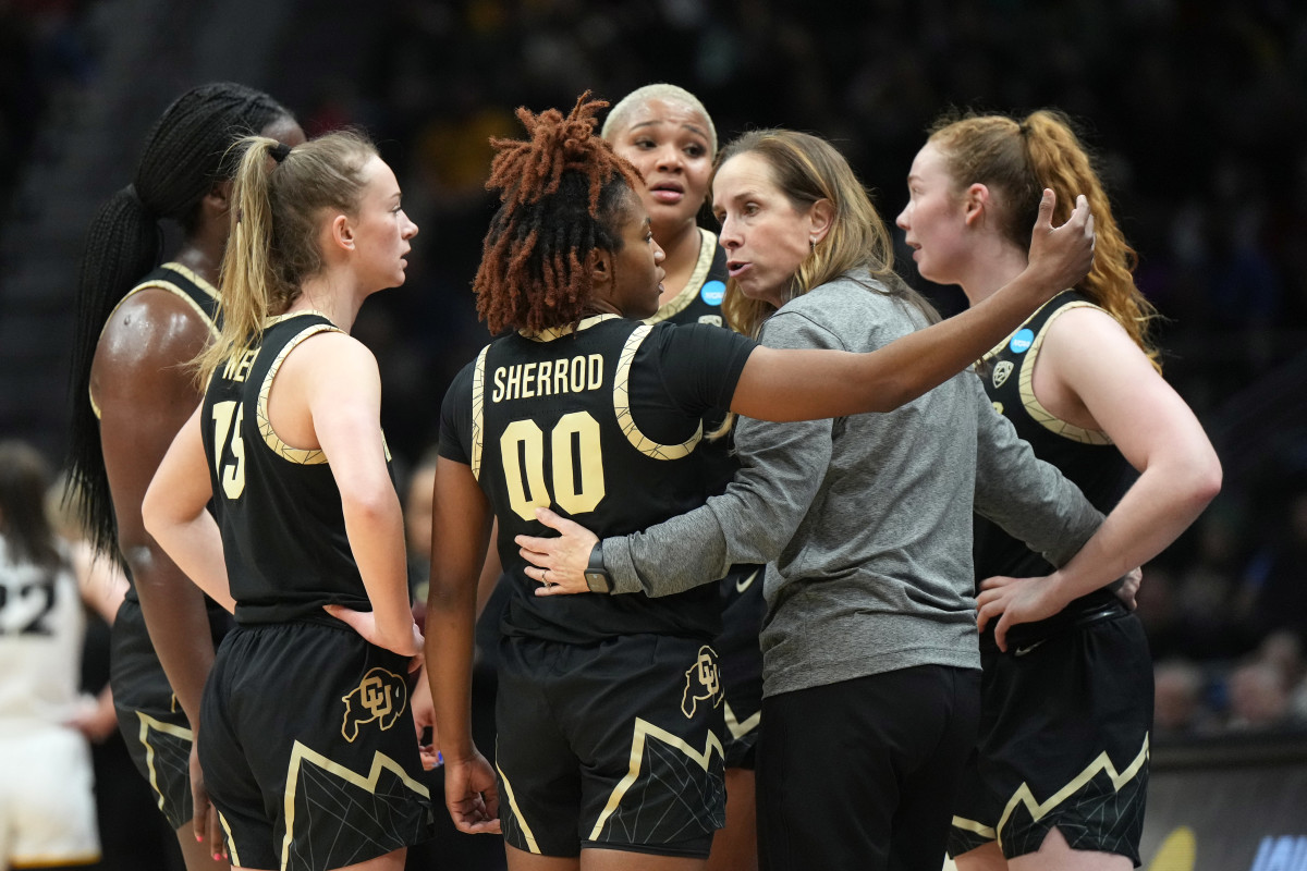 Colorado Buffaloes coach JR Payne huddles with guard Jaylyn Sherrod (00) against the Iowa Hawkeyes in the second half at Climate Pledge Arena.