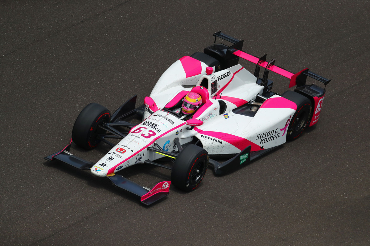 Mann in her pink helmet and car during the 2017 Indy 500. 