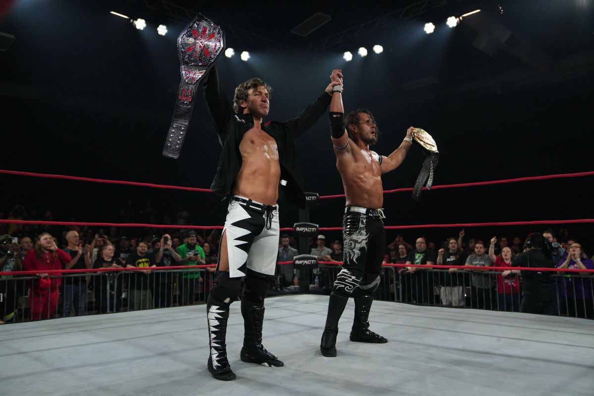 The Motor City Machine Guns celebrate in the ring