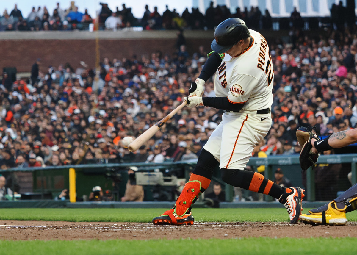 SF Giants designated hitter Joc Pederson hits an RBI single during the fifth inning at Oracle Park on June 21, 2023.
