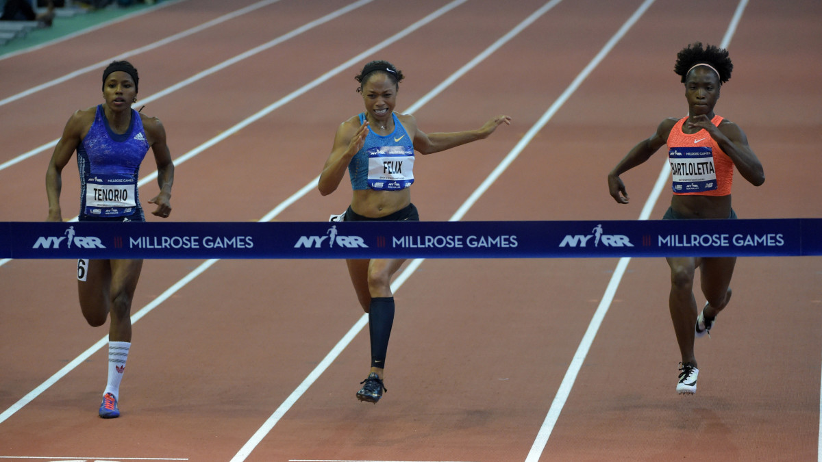 Allyson Felix (USA), center, wins the womens 60m in 7.15 during the 109th Millrose Games at The Armory.