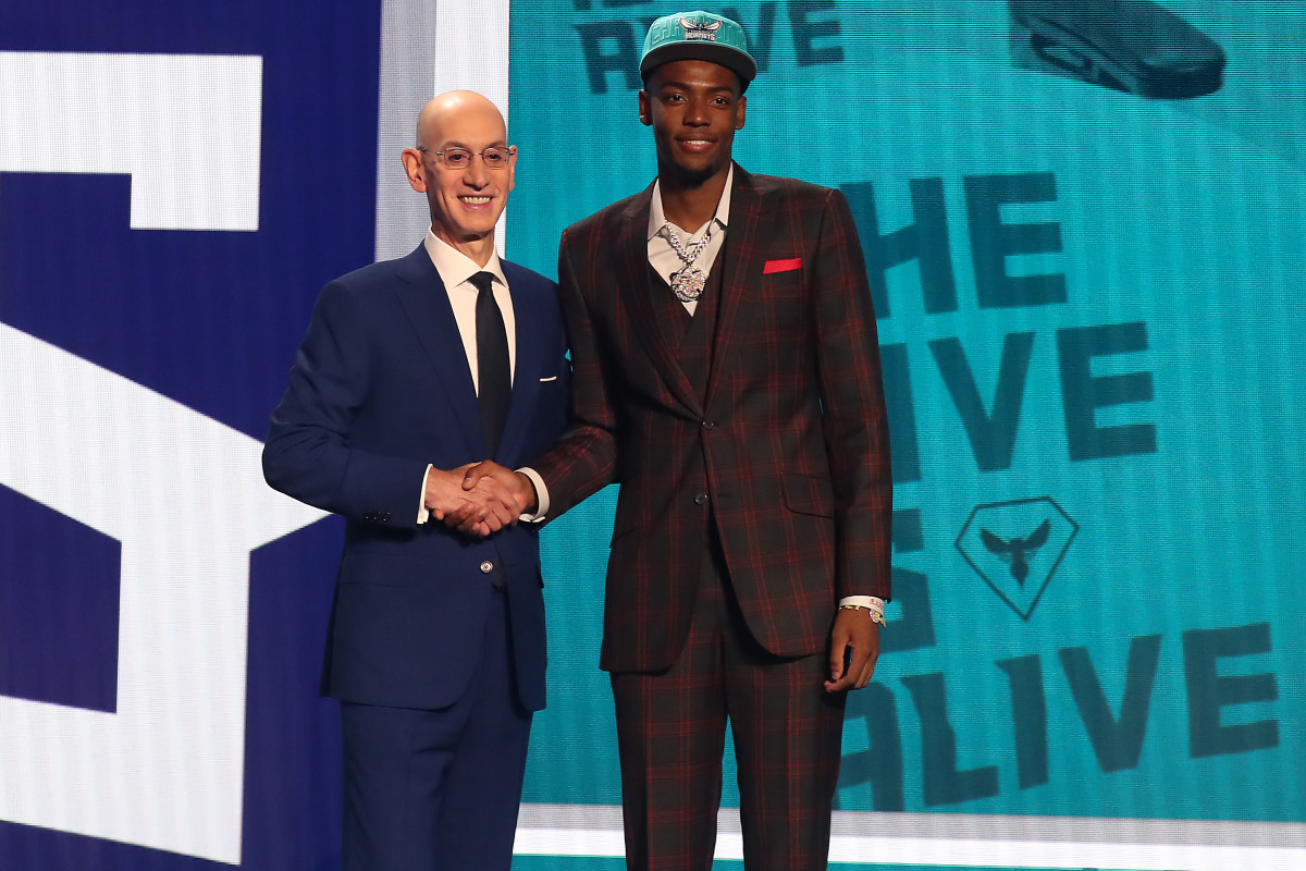 Brandon Miller (Alabama) poses with NBA commissioner Adam Silver after being selected second by the Charlotte Hornets in the first round of the 2023 NBA Draft at Barclays Arena.