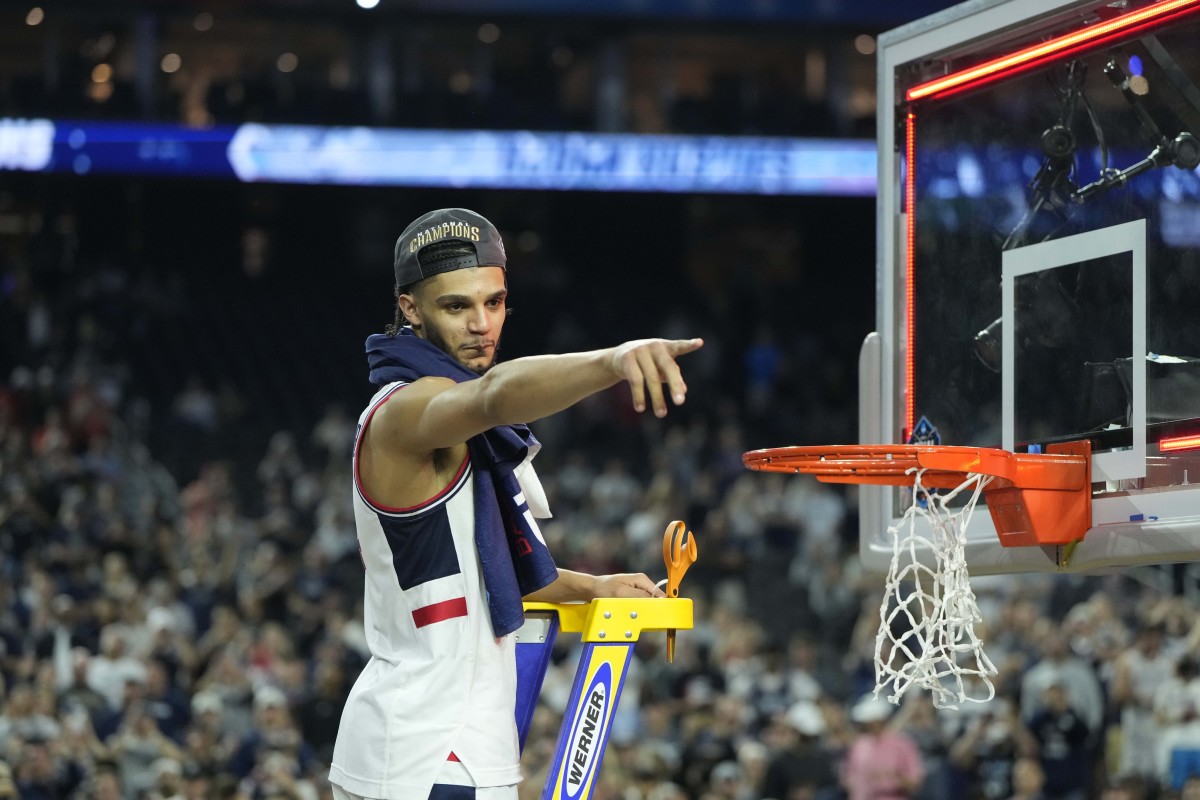 Connecticut Huskies guard Andre Jackson Jr. (44) celebrates while cutting down the net