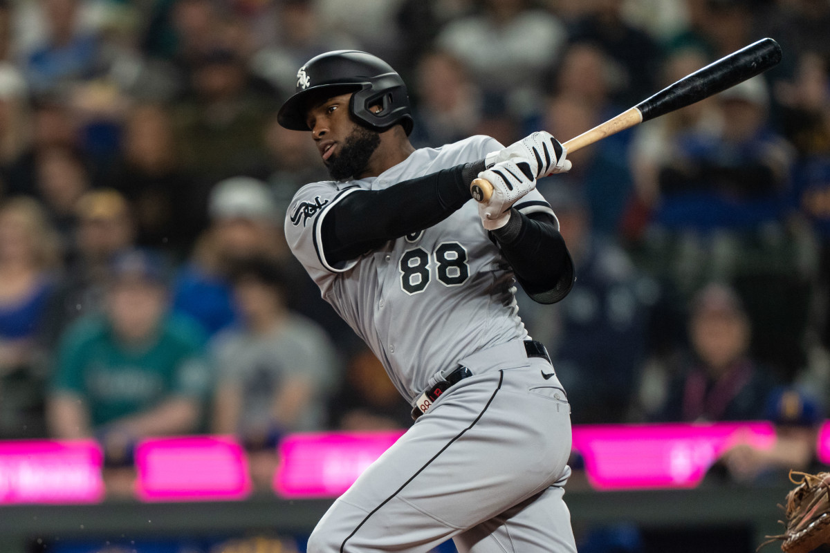 Chicago White Sox center fielder Luis Robert Jr. takes a swing during an at-bat against the Seattle Mariners at T-Mobile Park. (2023)