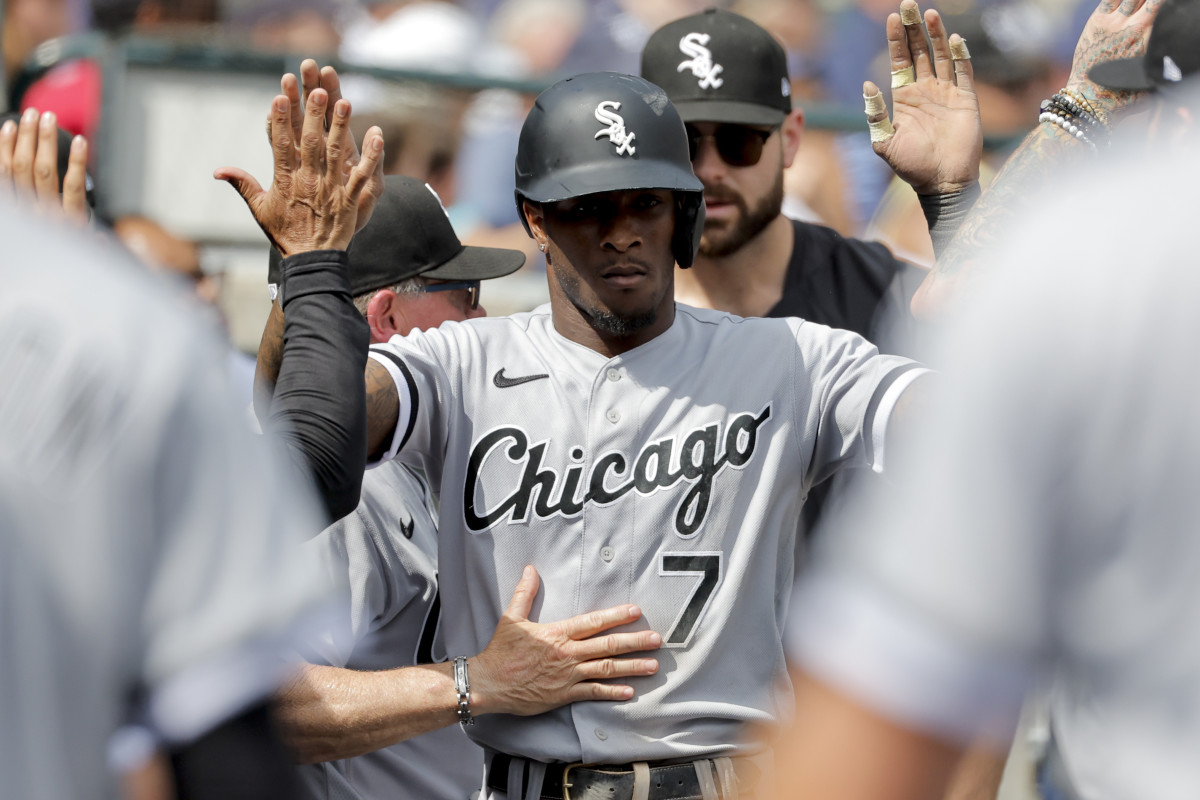 Chicago White Sox shortstop Tim Anderson receives congratulations from teammates after scoring in the seventh inning against the Detroit Tigers. (2023)