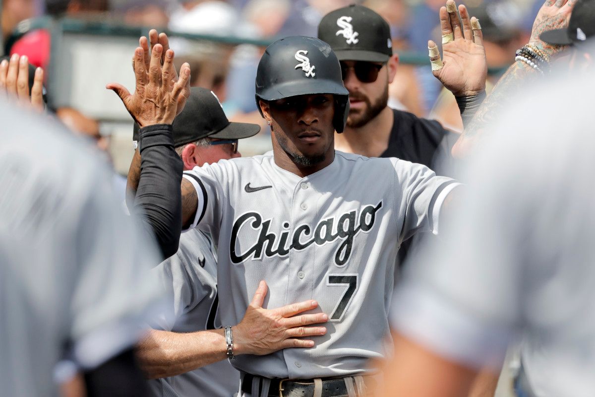 Chicago White Sox shortstop Tim Anderson receives congratulations from teammates after scoring in the seventh inning against the Detroit Tigers. (2023)