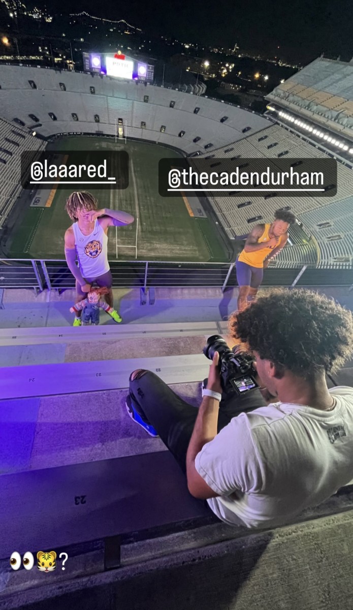 Jelani Watkins (left) and Caden Durham (right) pose in Tiger Stadium for a photoshoot with LSU quarterback Rickie Collins, per Durham's Instagram. 