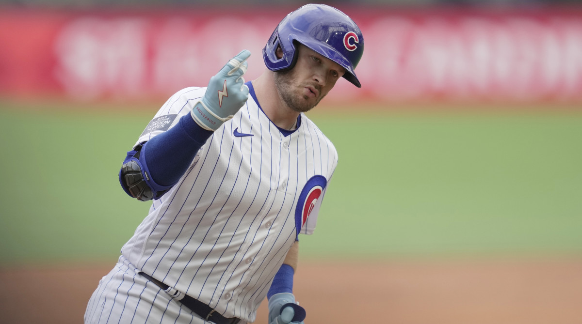 Cubs' Ian Happ rounds third base after hitting a solo home run during the second inning vs. the Cardinals.