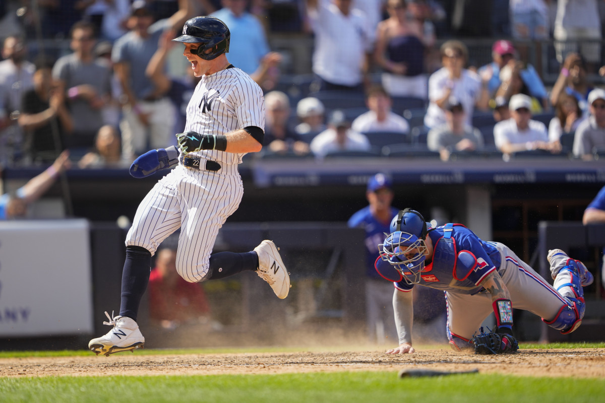 Jun 25, 2023; Bronx, New York, USA; New York Yankees center fielder Harrison Bader (22) scores a run on an RBI single hit by designated hitter Giancarlo Stanton (not pictured) against the Texas Rangers during the eighth inning at Yankee Stadium. Mandatory Credit: Gregory Fisher-USA TODAY Sports