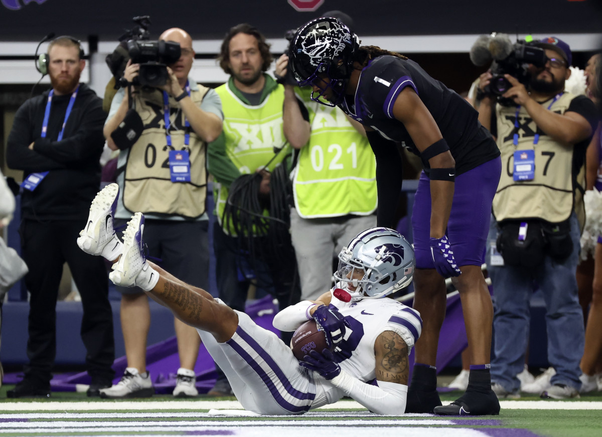Dec 3, 2022; Arlington, TX, USA; Kansas State Wildcats cornerback Julius Brents (23) makes an interception in fron tof TCU Horned Frogs wide receiver Quentin Johnston (1) during the second half at AT&T Stadium. Mandatory Credit: Kevin Jairaj-USA TODAY Sports