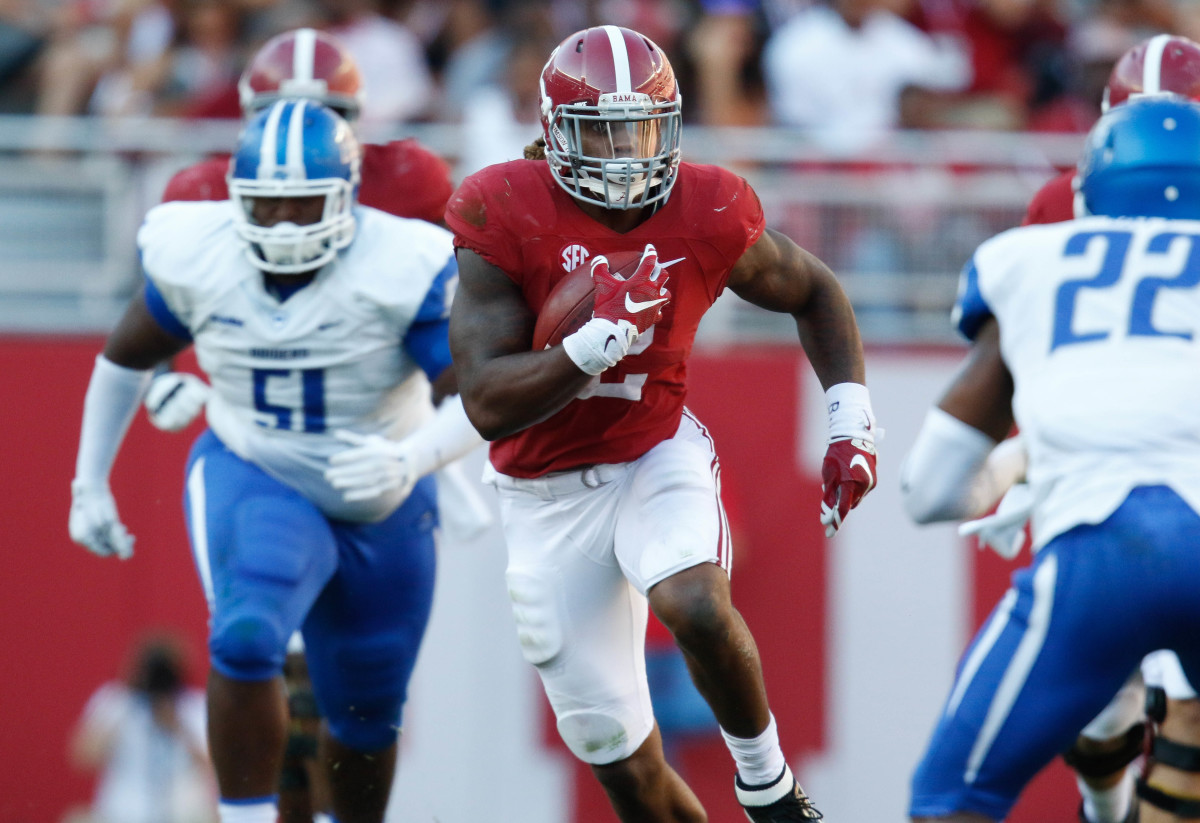 Sep 12, 2015; Tuscaloosa, AL, USA; Alabama Crimson Tide running back Derrick Henry (2) carries the ball against the Middle Tennessee Blue Raiders at Bryant-Denny Stadium.
