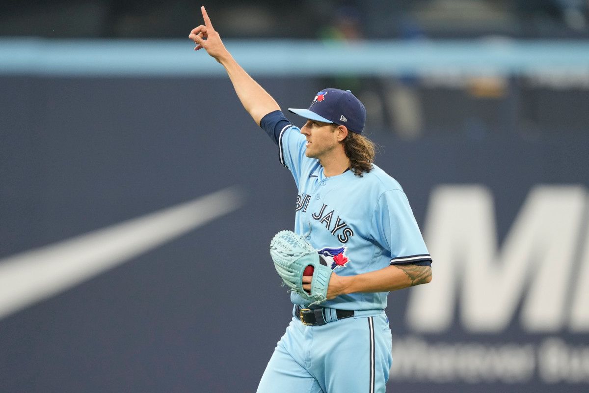 Toronto Blue Jays starting pitcher Kevin Gausman gestures to the fans after recording his 1500th career strikeout during the fourth inning against the SF Giants at Rogers Centre on June 27, 2023.