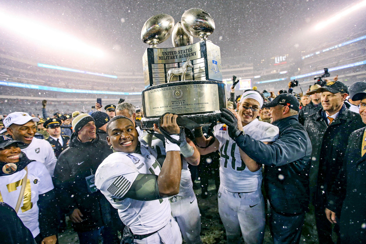 Army players celebrate winning the Commander-In-Chief’s Trophy game.