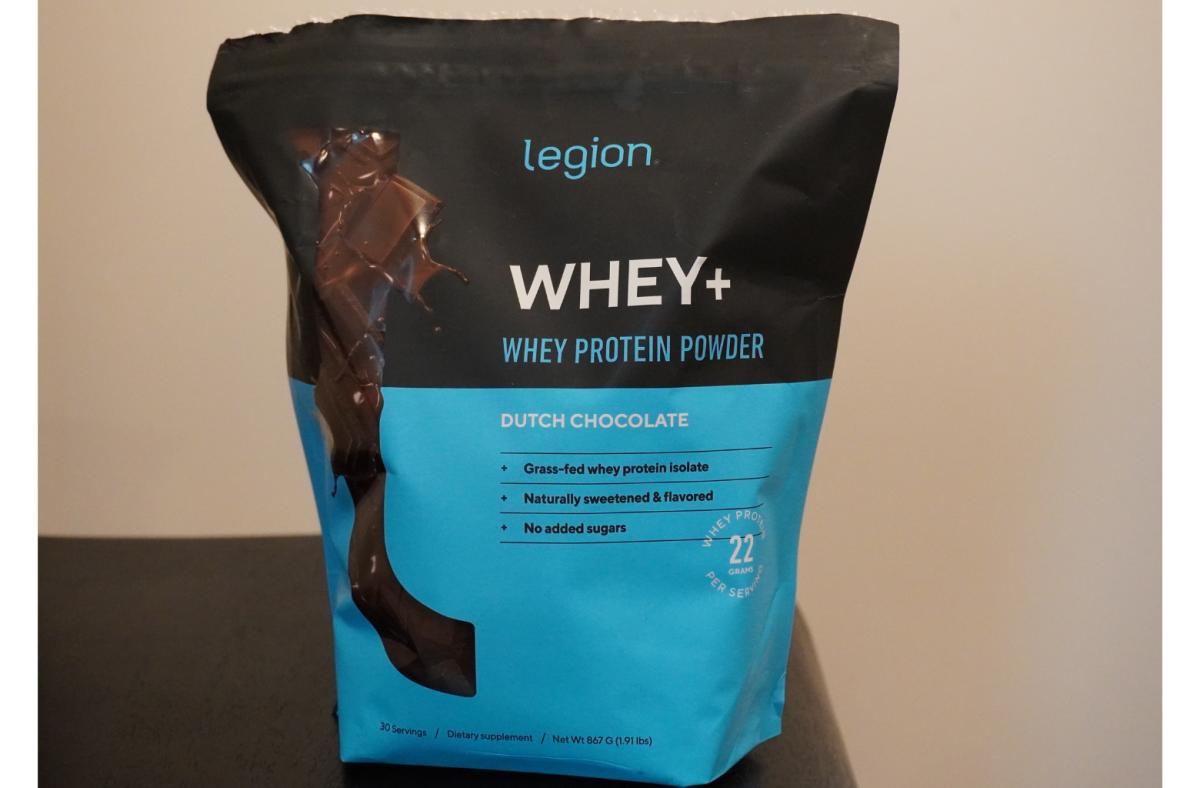 A 30-serving black and blue bag of Dutch Chocolate flavored Legion Whey+ protein powder