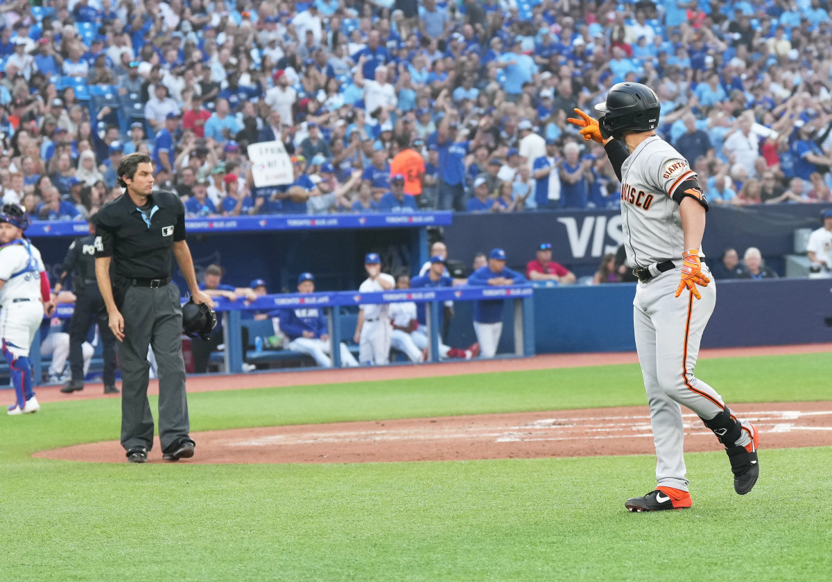 SF Giants third baseman J.D. Davis argues with the home plate umpire after being called out on strikes against the Toronto Blue Jays on June 29, 2023.