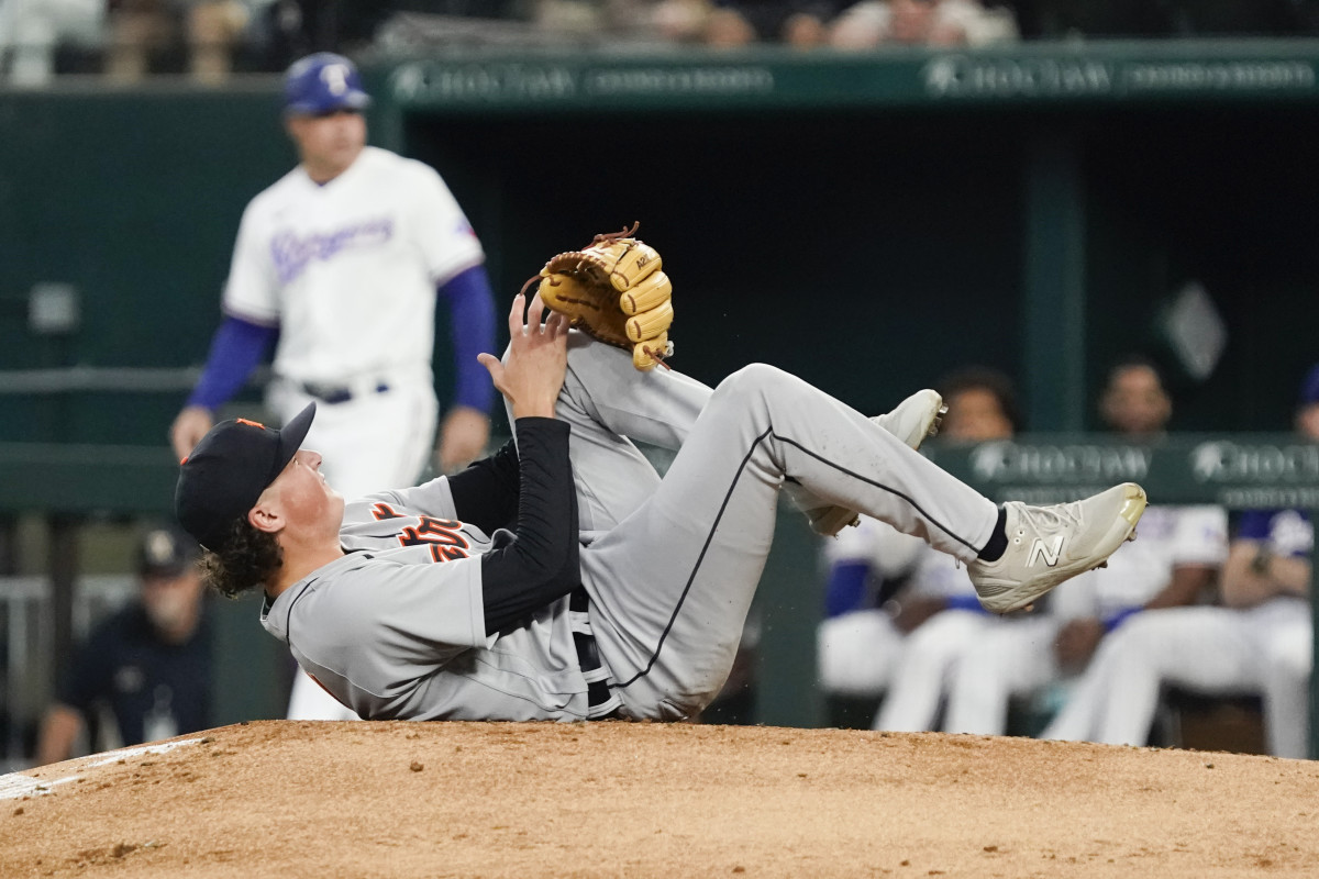 Jun 29, 2023; Arlington, Texas, USA; Detroit Tigers starting pitcher Reese Olson (45) grabs his left leg after being hit by a batted ball by Texas Rangers shortstop Josh Smith (not pictured) during the second inning at Globe Life Field. Mandatory Credit: Raymond Carlin III-USA TODAY Sports