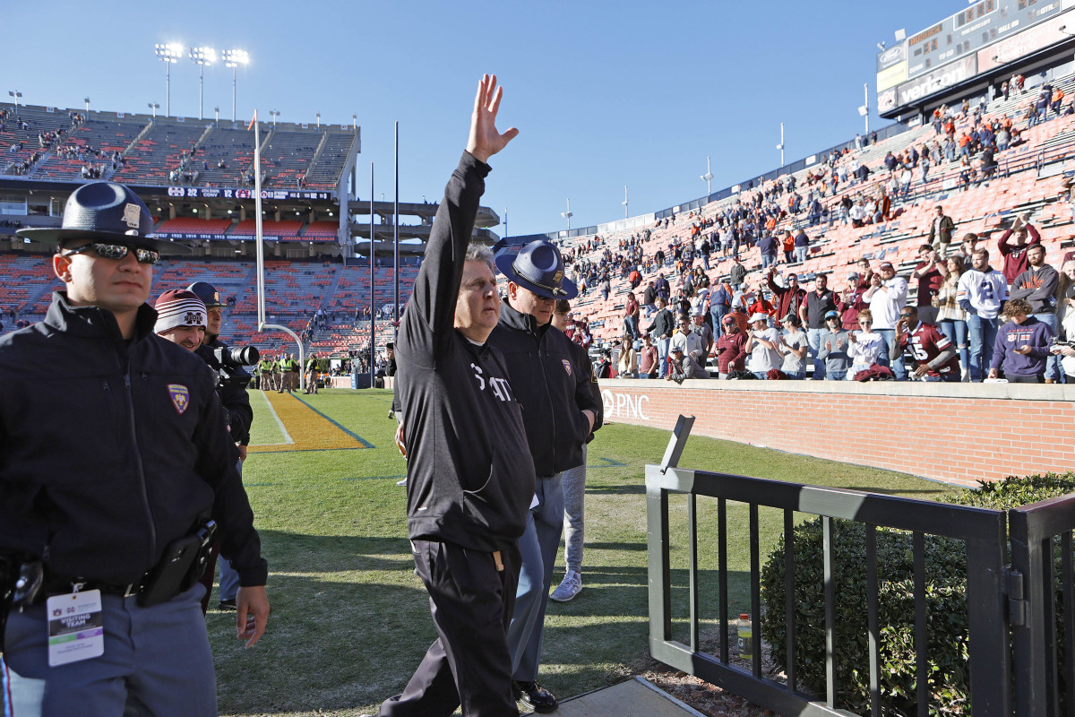 Mississippi State Bulldogs head coach Mike Leach waves to fans after the Bulldogs beat the Auburn Tigers at Jordan-Hare Stadium.