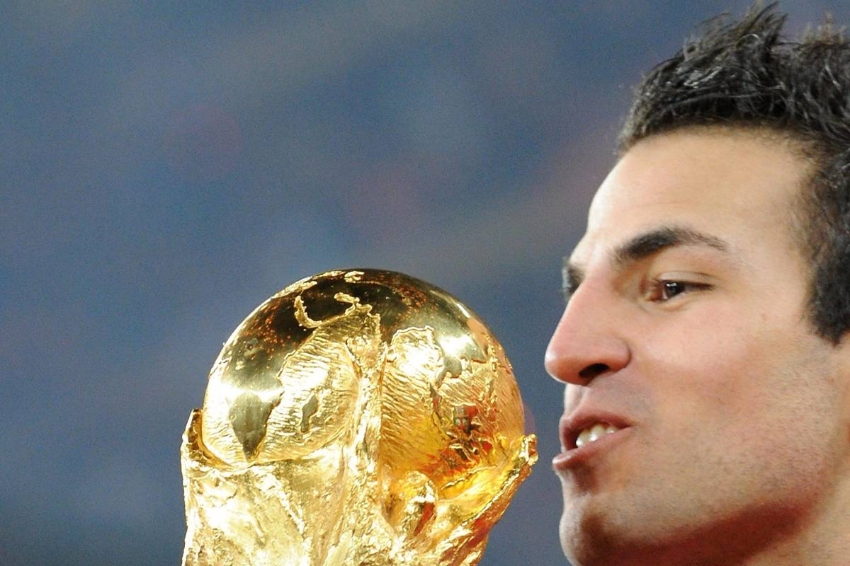 Cesc Fabregas pictured kissing the FIFA World Cup trophy in 2010 after Spain's victory over the Netherlands in the final