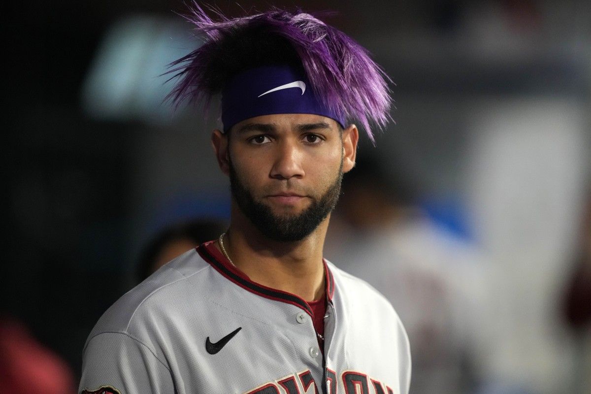 Diamondbacks outfielder Lourdes Gurriel Jr. (12) watches the game against the Angels from his own dugout.
