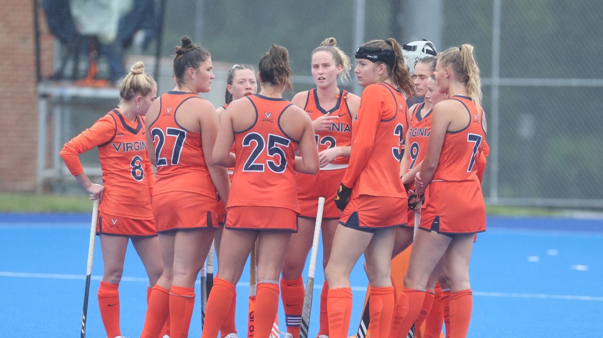 The Virginia field hockey team huddles during a game against William & Mary at the UVA Turf Field.