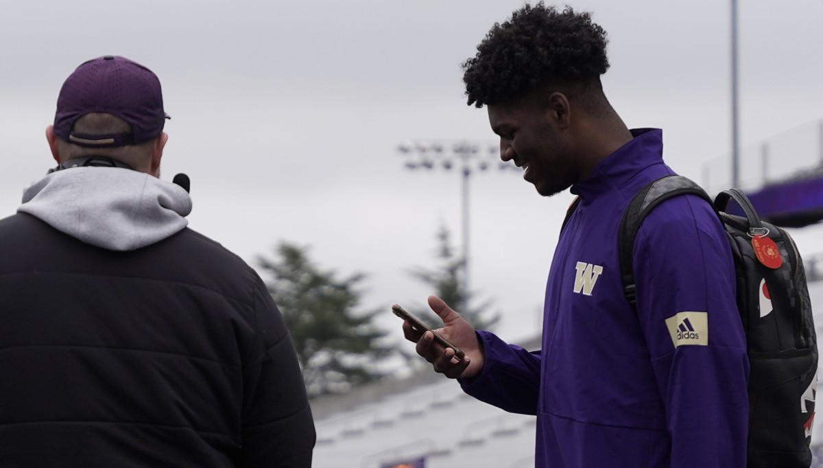 Recent signee Elishah Jackett, an offensive lineman, showed up at the UW for the final spring scrimmage.