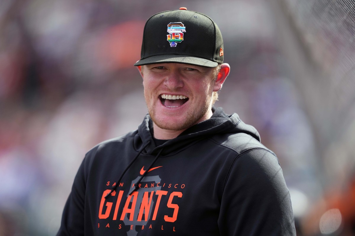 SF Giants starting pitcher Logan Webb laughs in front of the stands before a game at Oracle Park. (2023)