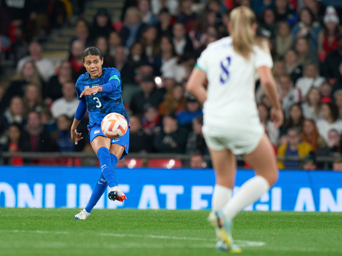 United states defender Alana Cook passes the ball in the match between United States and England at Wembley Stadium.