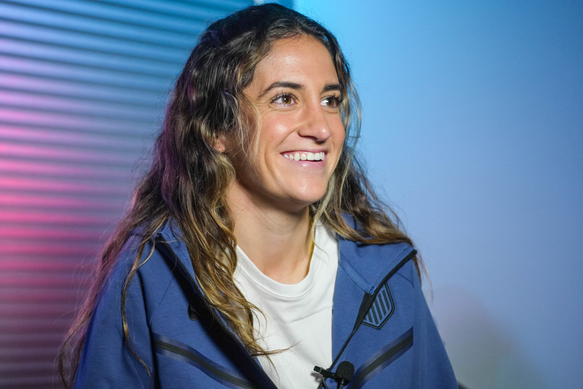 Midfielder Savannah DeMelo smiles while speaking to the media at the U.S. Women's national team media day.