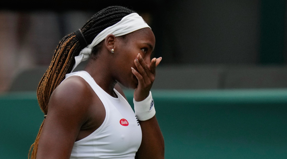 American tennis star Coco Gauff reacts to losing in the first round of Wimbledon 2023.