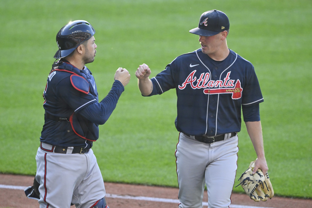 Jul 4, 2023; Cleveland, Ohio, USA; Atlanta Braves catcher Travis d'Arnaud (16) and starting pitcher Kolby Allard (49) celebrate in the second inning against the Cleveland Guardians at Progressive Field.