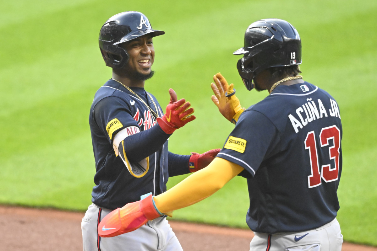 Jul 4, 2023; Cleveland, Ohio, USA; Atlanta Braves second baseman Ozzie Albies (1) celebrates his two-run home run with right fielder Ronald Acuna Jr. (13) in the fifth inning against the Cleveland Guardians at Progressive Field.