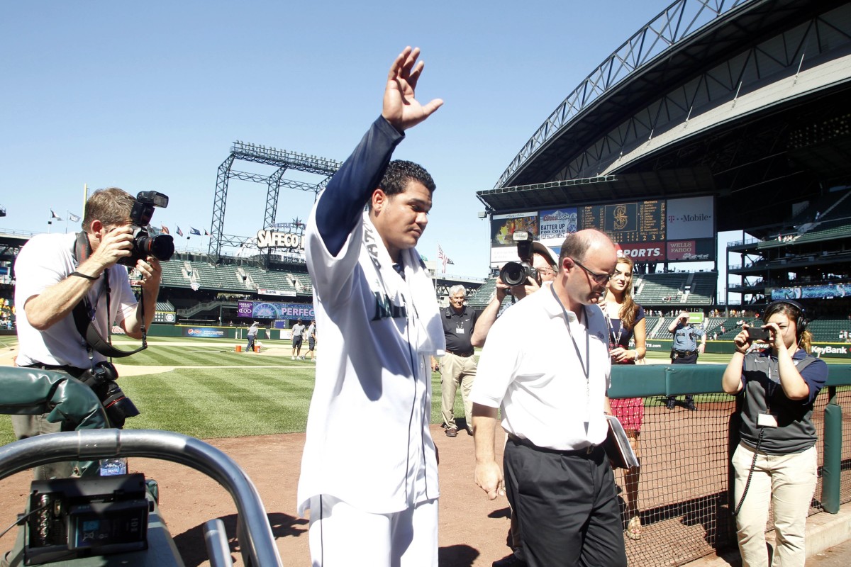Seattle Mariners pitcher Felix Hernandez (34) enters the clubhouse following his perfect game against the Tampa Bay Rays at Safeco Field. (Joe Nicholson-USA TODAY Sports)