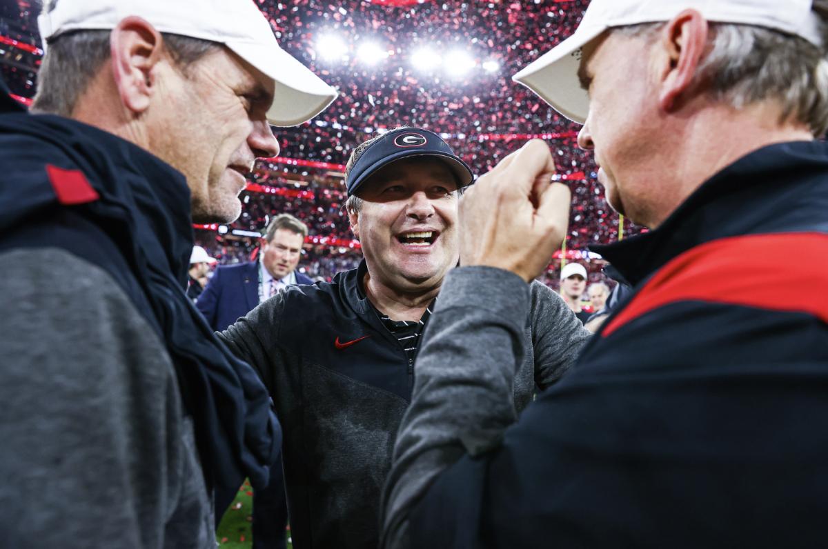 Coaches Kirby Smart, Todd Monken, and Mike Bobo celebrate after winning the 2023 national championship