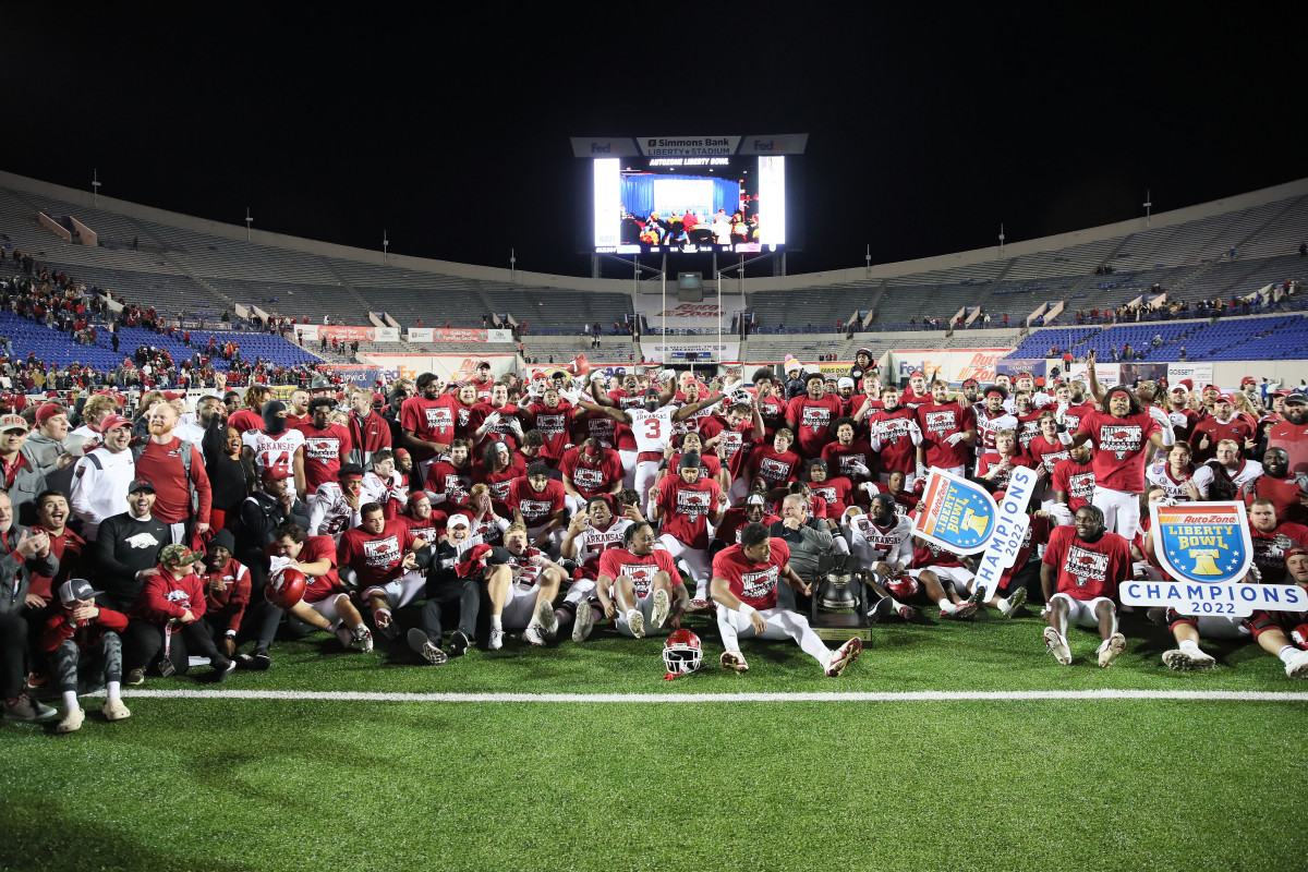 Dec 28, 2022; Memphis, TN, USA; Arkansas Razorbacks team, coaches and personnel pose for a photo after defeating the Kansas Jayhawks in the 2022 Liberty Bowl at Liberty Bowl Memorial Stadium.