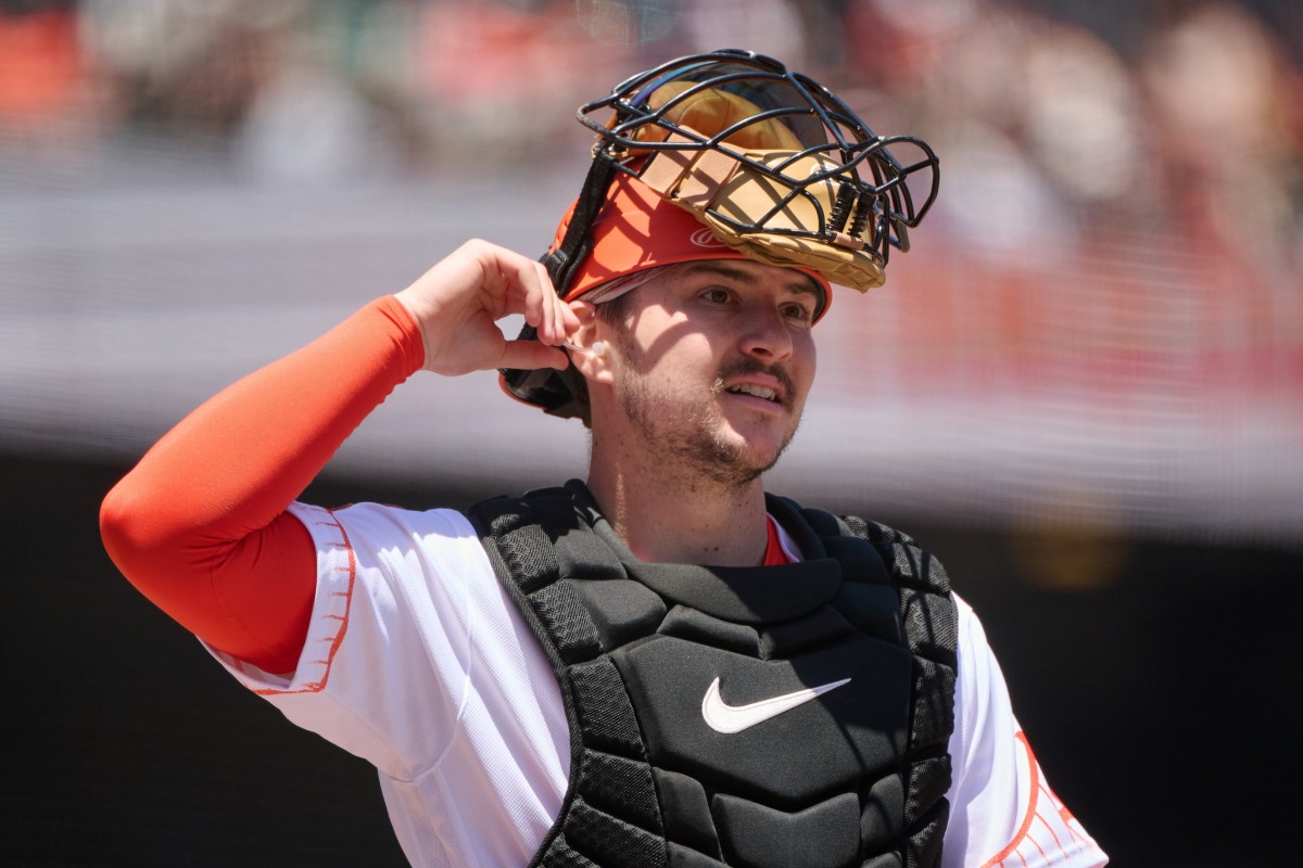 SF Giants catcher Patrick Bailey (14) walks on the field with his catchers mask lifted at Oracle Park (2023)