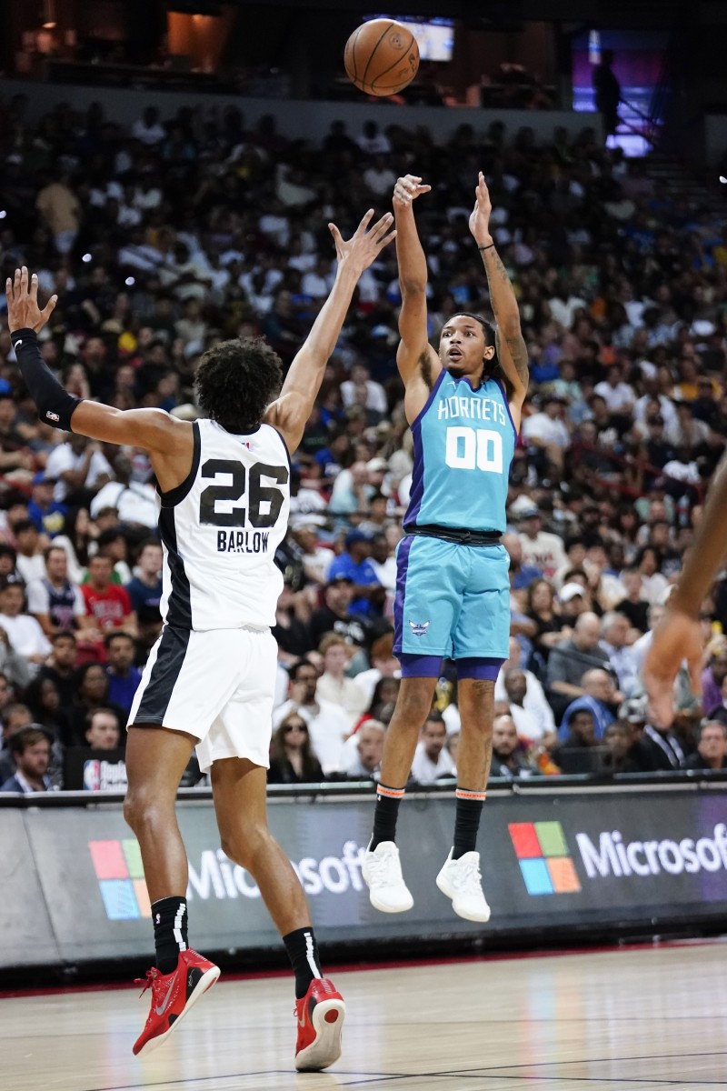 Charlotte Hornets guard Nick Smith Jr. (00) shoots the ball against San Antonio Spurs forward Dominick Barlow (26) during the first half at Thomas & Mack Center.