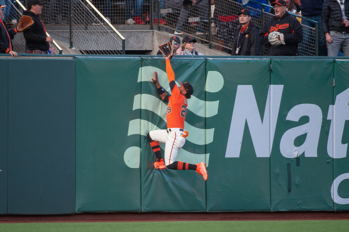 SF Giants outfielder Luis Matos attempts to catch a home run against the Colorado Rockies during the first inning at Oracle Park on July 7, 2023.