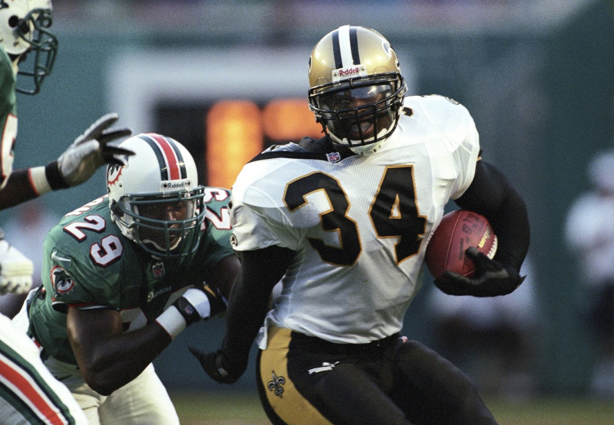 Aug 13, 1999; FILE PHOTO; New Orleans Saints running back Ricky Williams (34) running the ball against the Miami Dolphins. Mandatory Credit: RVR Photos-USA TODAY Sports