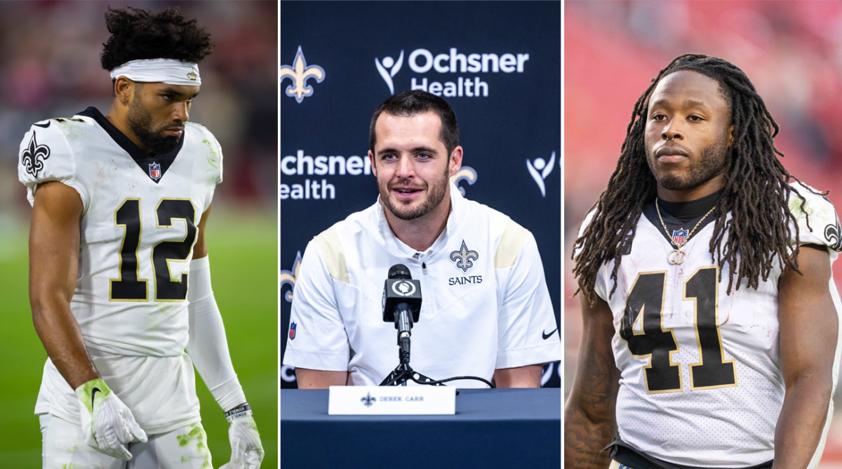 Chris Olave walks, Derek Carr sits at a podium, Alvin Kamara looks straight ahead