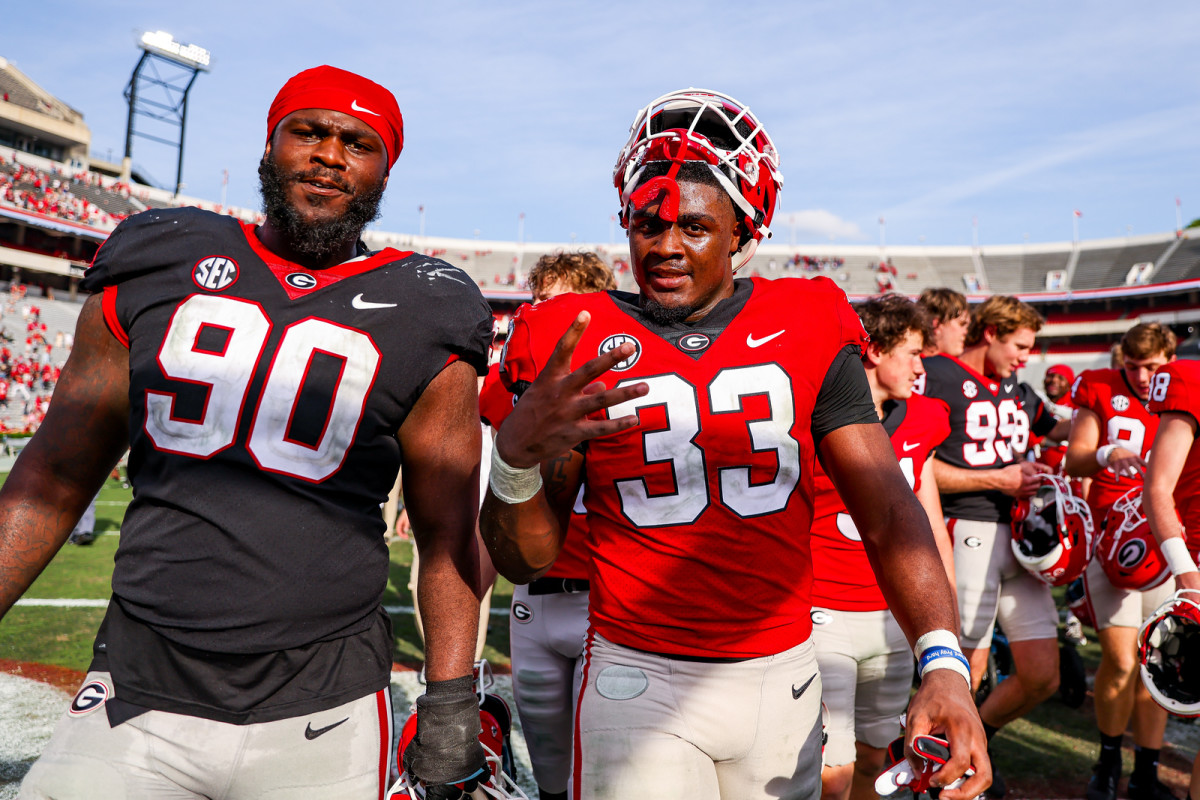 Georgia defensive lineman Tramel Walthour (90), Georgia inside linebacker C.J. Allen (33) after Georgia’s annual G-Day scrimmage on Dooley Field at Sanford Stadium in Athens, Ga., on Saturday, April 15, 2023. (Tony Walsh/UGAAA)