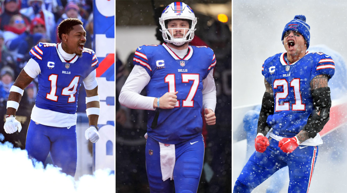 Stefon Diggs yells with his fists pushing down by his sides as smoke comes up around his legs; Josh Allen jogs onto the field; Jordan Poyer yells in celebration with his arms clenching downward