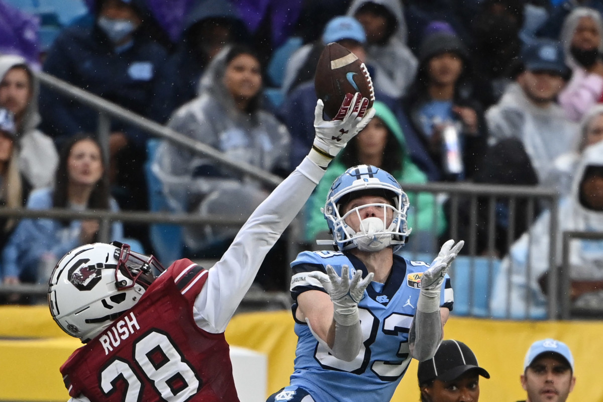 Dec 30, 2021; Charlotte, NC, USA; South Carolina Gamecocks defensive back Darius Rush (28) breaks up a pass intended for North Carolina Tar Heels wide receiver Justin Olson (83) in the second quarter during the 2021 Duke's Mayo Bowl at Bank of America Stadium. Mandatory Credit: Bob Donnan-USA TODAY Sports