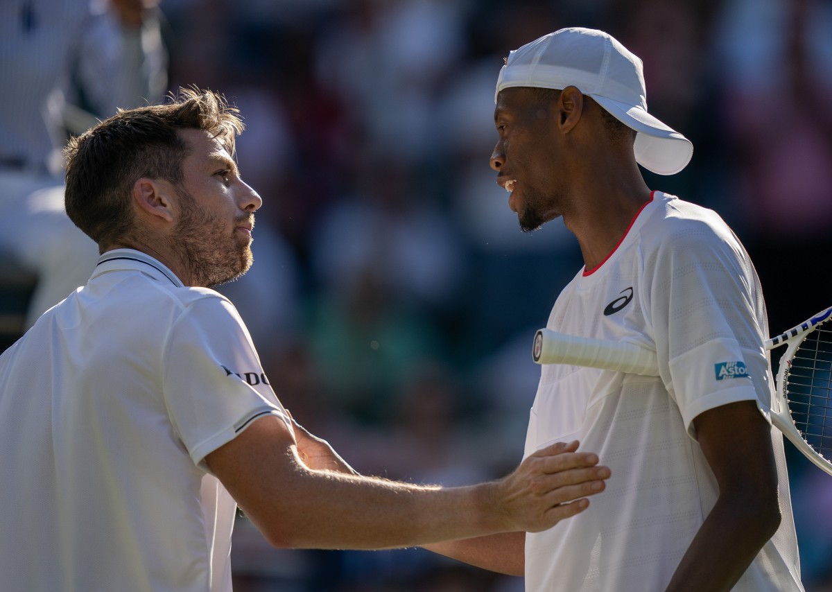 Jul 7, 2023; London, United Kingdom; Christopher Eubanks (USA) at the net with Cameron Norrie (GBR) after their match on day five at the All England Lawn Tennis and Croquet Club.