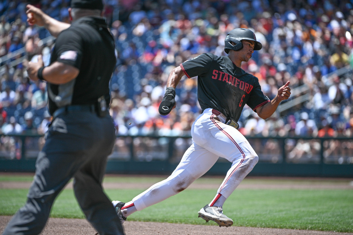 Jun 19, 2023; Omaha, NE, USA; Stanford Cardinal right fielder Braden Montgomery (6) rounds third base and scores against the Tennessee Volunteers in the first inning at Charles Schwab Field Omaha. Mandatory Credit: Steven Branscombe-USA TODAY Sports