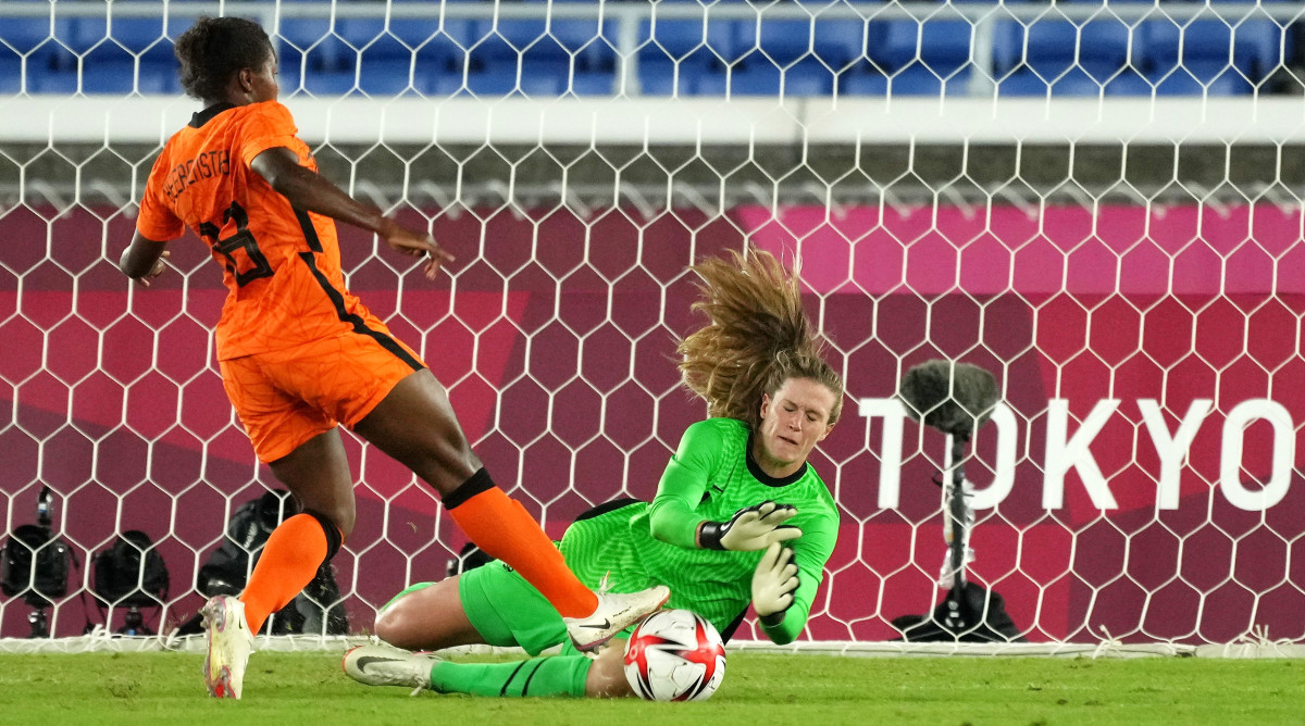 United States goalkeeper Alyssa Naeher dives for the ball as Netherlands forward Lineth Beerensteyn makes a play for it during the quarterfinals during the Tokyo Olympics.