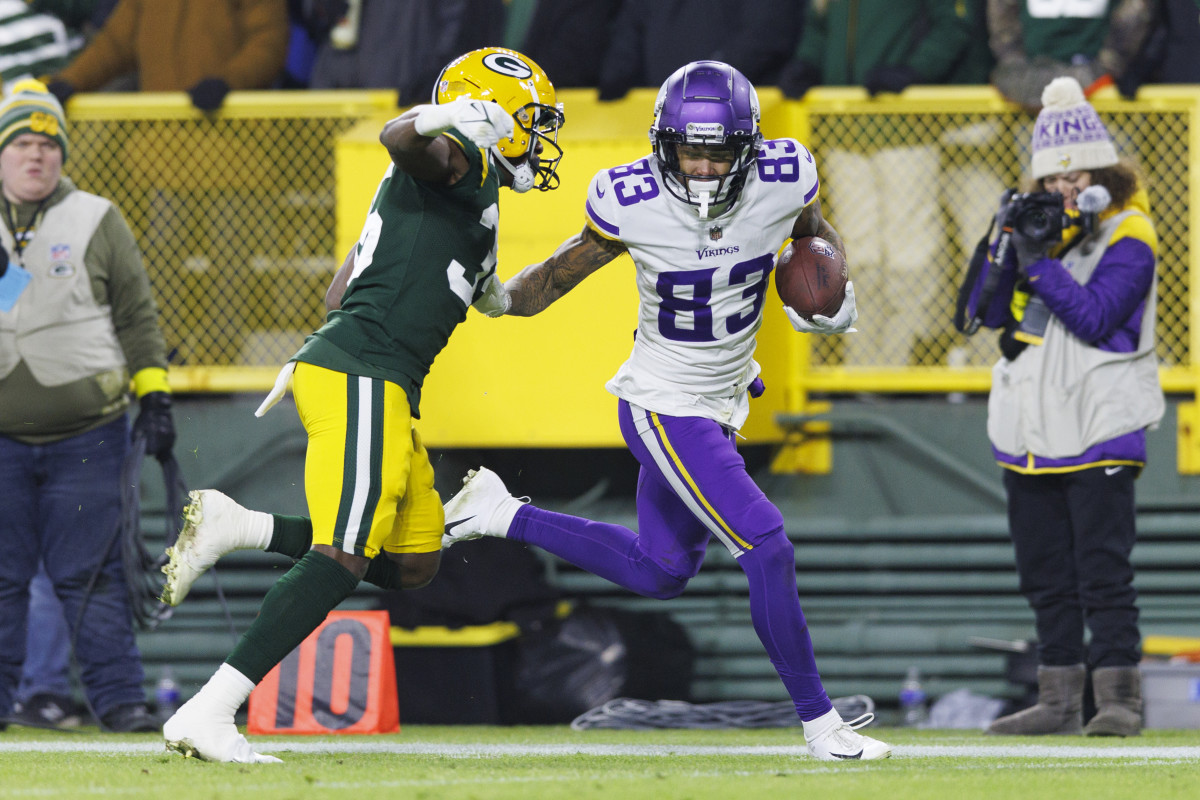 Jan 1, 2023; Green Bay, Wisconsin, USA; Minnesota Vikings wide receiver Jalen Nailor (83) rushes for a touchdown as Green Bay Packers cornerback Corey Ballentine (35) defends during the fourth quarter at Lambeau Field.