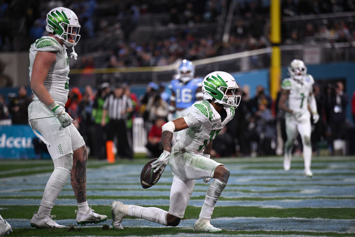 Dec 28, 2022; San Diego, CA, USA; Oregon Ducks wide receiver Troy Franklin (11) celebrates after scoring a touchdown against the North Carolina Tar Heels during the second half of the 2022 Holiday Bowl at Petco Park. Mandatory Credit: Orlando Ramirez-USA TODAY Sports
