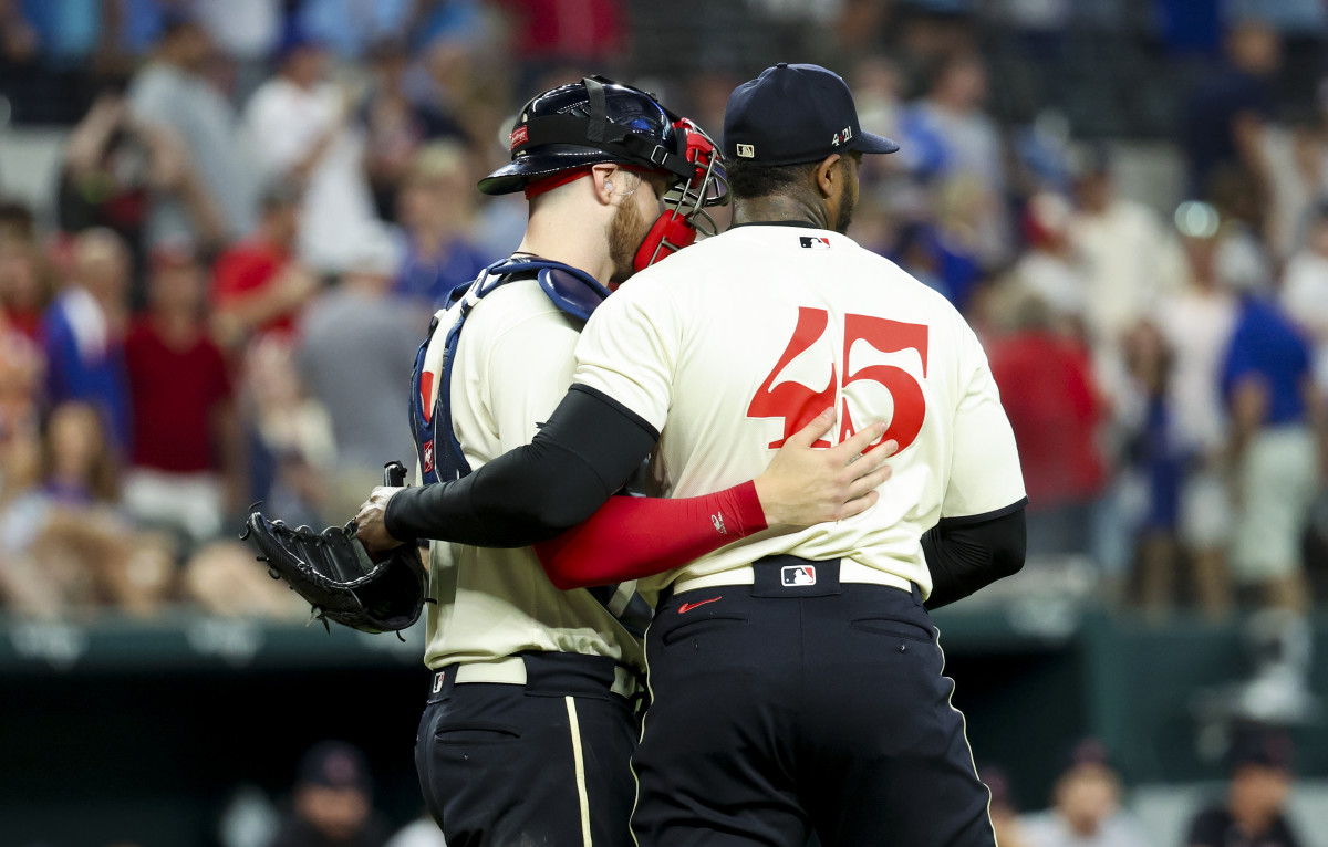Jul 15, 2023; Arlington, Texas, USA; Texas Rangers relief pitcher Aroldis Chapman (45) and Texas Rangers catcher Jonah Heim (28) celebrate after the game against the Cleveland Guardians at Globe Life Field. Mandatory Credit: Kevin Jairaj-USA TODAY Sports