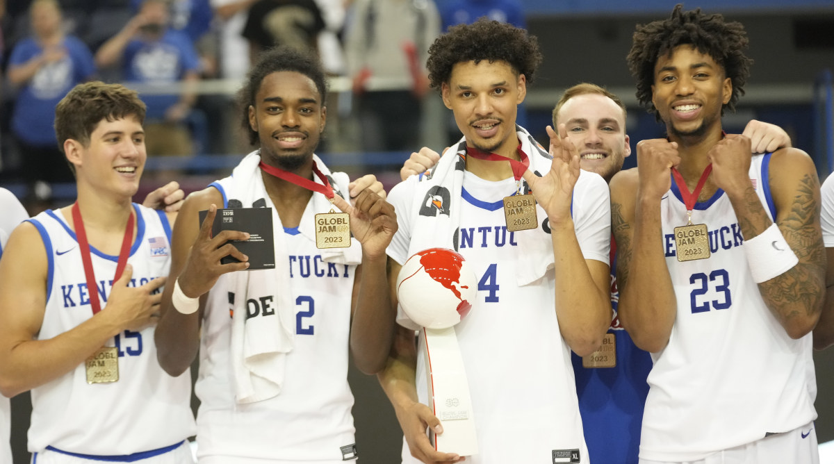 From left, Kentucky guard Reed Sheppard, guard Antonio Reeves, forward Tre Mitchell and guard Jordan Burks pose with their tournament medals and trophy after defeating Canada in the 2023 Global Jam.
